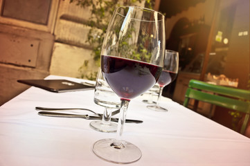 Glass of red wine at outdoor restaurant