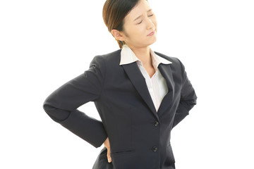 腰痛を訴えるOL