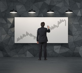 Fototapeta premium businessman drawing graph