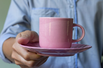 A cup of coffee in man hand