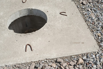 Manhole without cover in new concrete block