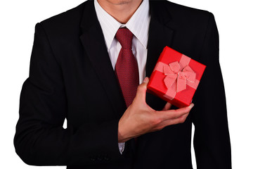 Businessman holding a gift box isolated