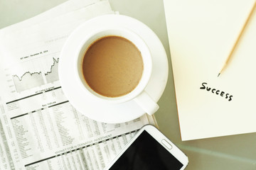 business newspaper and coffee