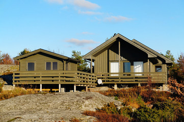 Fototapeta na wymiar Green cottage with additional sauna
