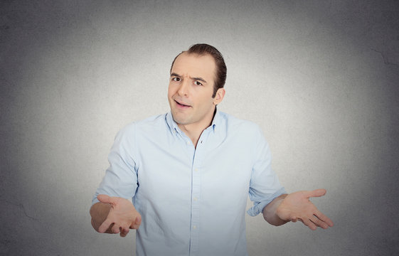 dumb clueless funny looking man arms out asking what's problem