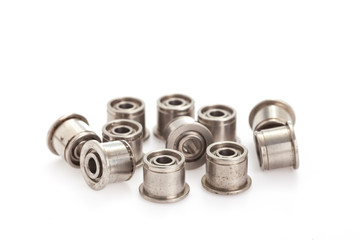 lot of small ball bearings on the white background