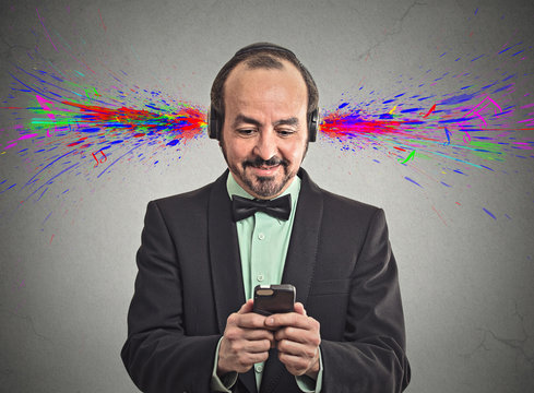 man listening music with headphones sound colorful splashes