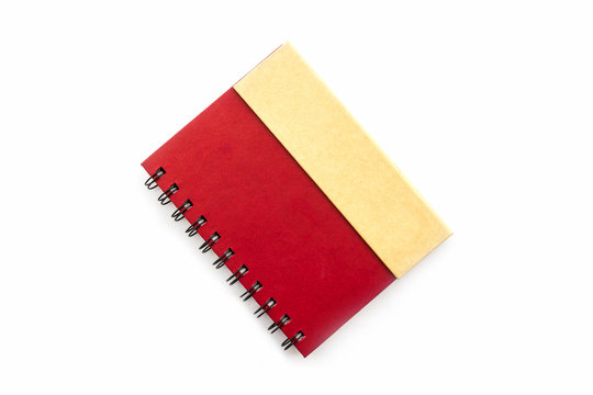 Red diary book on white background.