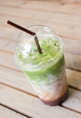 Milk green tea smoothie in plastic cup