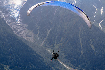 Paraglider above alps 