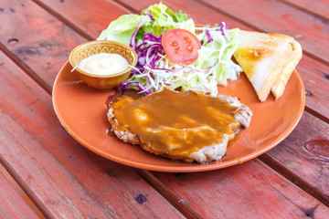 grilled pork steak with salad
