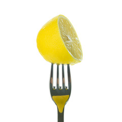 Half lemon on fork