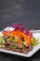 Asian Sliced Beef Salad with red cabbage and Carrots