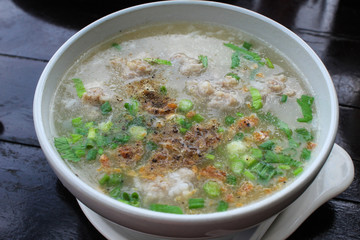 Thai style breakfast soft boiled rice mixed with ground pork