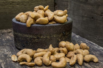 Cashew nuts and ceramic bowl