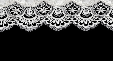 white lace on black background - obrazy, fototapety, plakaty