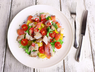 Fresh fish salad with vegetables