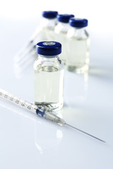 Vaccine in vial with syringe