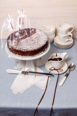 Festive Cake with chocolate glaze on table
