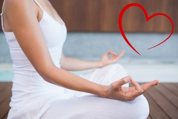 Peaceful woman in white sitting in lotus pose