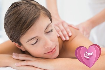 Fototapeta na wymiar Attractive woman receiving back massage at spa center