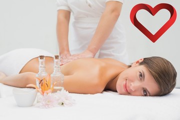 Obraz na płótnie Canvas Attractive young woman receiving back massage