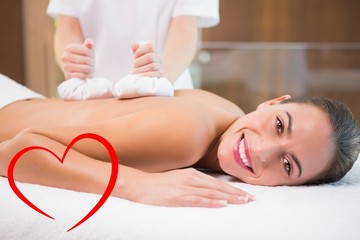 Fototapeta na wymiar Attractive woman receiving treatment at spa center