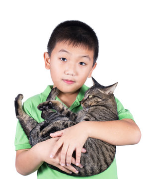 boy hugging with his cute tiger cat isolated on white background