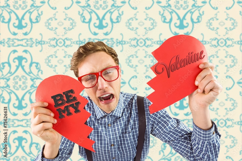 Poster Composite image of geeky hipster holding a broken heart