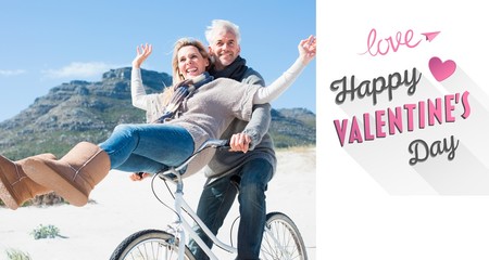 Fototapeta premium Carefree couple going on a bike ride on the beach