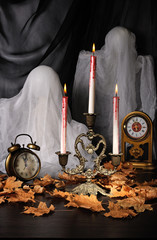 Candles among the fallen leaves