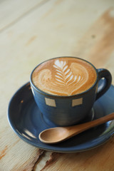 cup of coffee with book in coffee shop vintage color