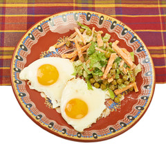 Вreakfast of scrambled eggs and lettuce on a plate