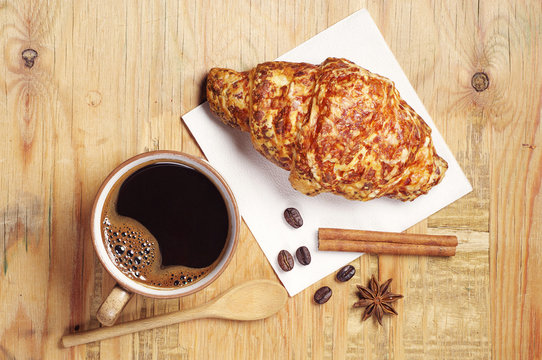 Coffee and croissant with cheese