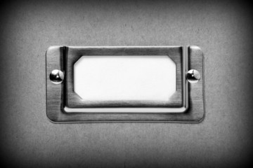 Metal filing cabinet label in black and white with copy space