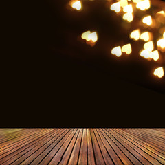  wooden deck table over heart bokeh background. Valentine's day