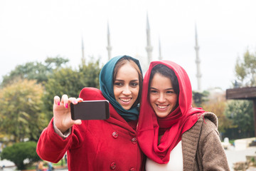 Arab Women Wearing Veil Taking Selfie in Istanbul