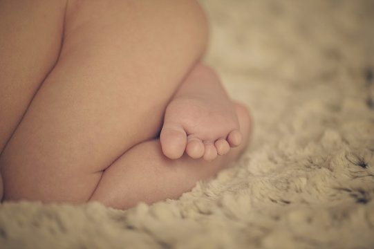 Small little foot of newborn baby