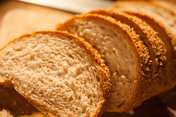 Sliced bread on cutting board closeup