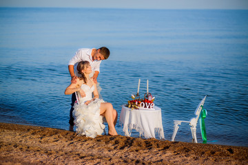 happy bride and groom on the beach