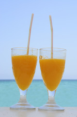 Two glasses with orange juice