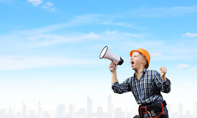 Woman builder with megaphone