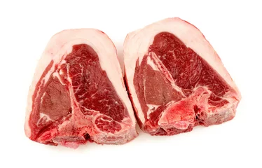 Gartenposter Two cuts of raw uncooked lamb chops © Enlightened Media