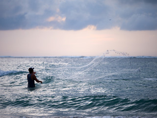 Fisherman on the beach of Kuta in Bali