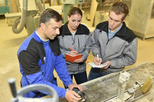 Students Taking Notes In Workshop Course