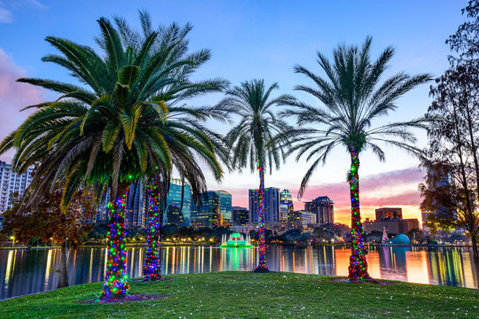 Orlando, Florida, USA Cityscape and Palm Trees at Eola Lake