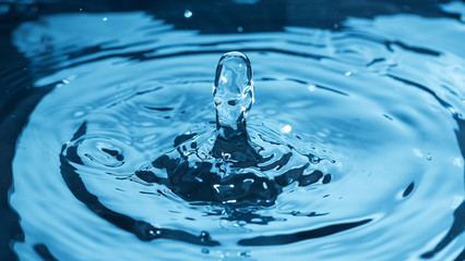 Fototapeta na wymiar Water splash on surface as human face