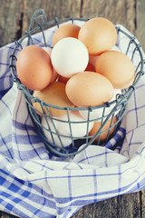 Fototapeta na wymiar fresh farm eggs in iron basket
