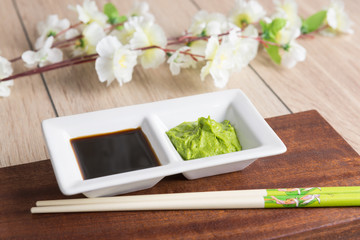 soy sauce, wasabi and chopsticks - obrazy, fototapety, plakaty
