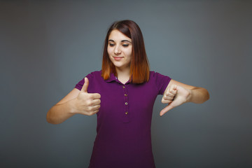 Girl 20 years of European appearance haired showing thumbs up si